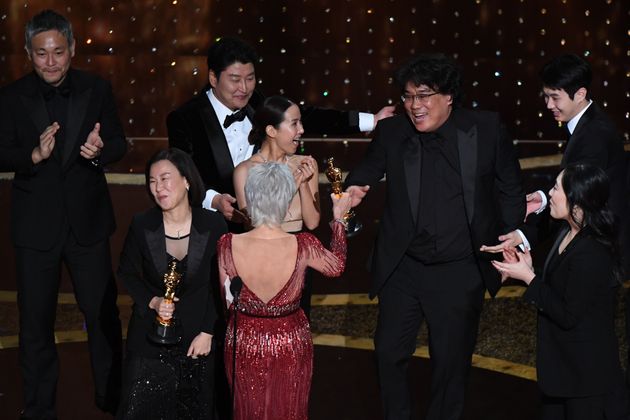 "Parasite" producers Kwak Sin-ae (L) and Bong Joon-ho (R) accept the award for Best Picture for "Parasite" during the 92nd Oscars at the Dolby Theatre in Hollywood, California on February 9, 2020. (Photo by Mark RALSTON / AFP)