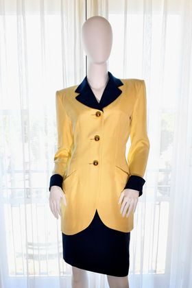 Princess Diana's 1989 Hong Kong royal tour yellow and navy skirt suit by Catherine Walker is displayed during Julien's Auctions' press preview of "Princess Diana's Elegance & a Royal Collection", ahead of an exclusive private showing at the Peninsula Beverly Hills, Beverly Hills, California, June 25, 2024. (Photo by VALERIE MACON / AFP)