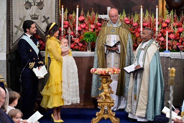 Prince Carl Philip of Sweden (L) and Princess Sofia of Sweden (2nd L) with Princess Ines and the christening celebrants the Chief Chaplain, Bishop Johan Dalman and the Pastor of the Royal Court Assembly, Ordinary Chaplain Michael Bjerkhagen, are pictuerd during Princess Ines's christening in Drottningholm Palace Chapel in Stockholm, Sweden, on June 13, 2025. (Photo by Jonas EKSTROMER / TT News Agency / AFP) / Sweden OUT
