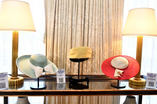 Princess Diana's hats by Philip Somerville (L-R) 1989 teal hat, 1987 yellow and black turban, and red and cream straw hat worn on tour in Australia are on display at Julien's Auctions' press preview of "Princess Diana's Elegance & a Royal Collection", ahead of an exclusive private showing at the Peninsula Beverly Hills, Beverly Hills, California, June 25. (Photo by VALERIE MACON / AFP)